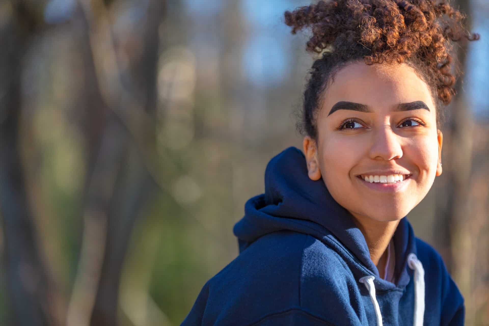 Happy Biracial Mixed Race African American Girl Teenager Smiling With Perfect Teeth